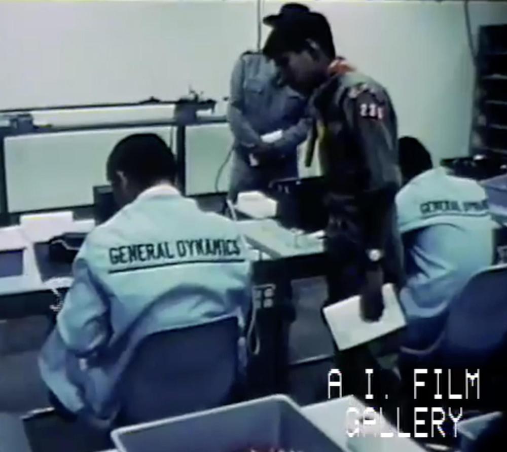 Navajo workers at the General Dynamics plant in Fort Defiance, AZ. From the 1965 General Dynamics film "The Navajo moves into the electronic age". From American Indian Film Gallery.