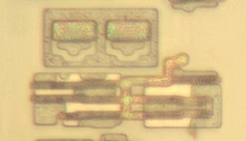 A BiCMOS inverter with two NPN transistors. The PMOS transistors are in the lower left and the NMOS transistors are in the lower right.
