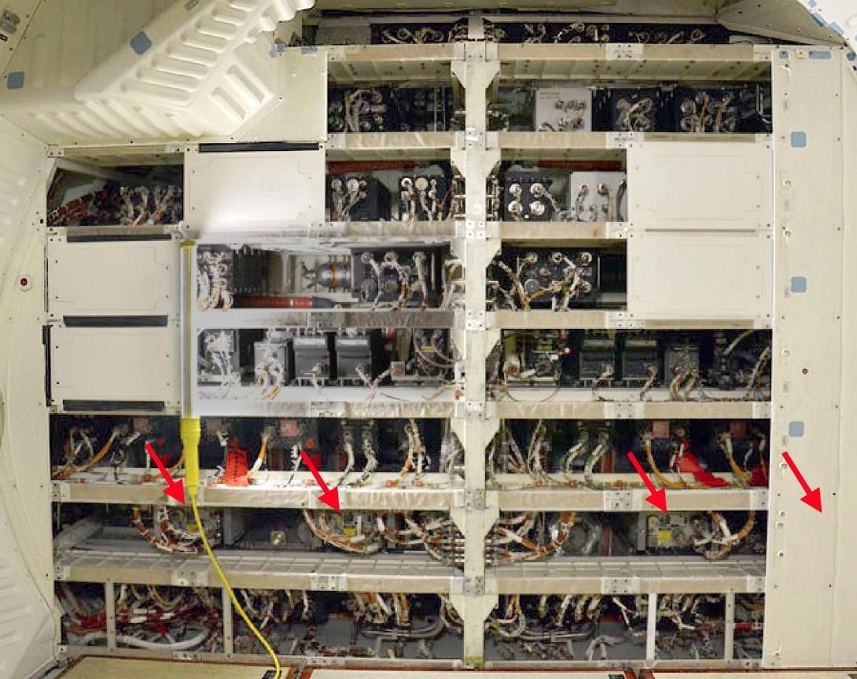 Avionics bays 1 and 2 are located in the crew cabin middeck, below the flight deck, and looking forward into the nose. The red arrows indicate the AP-101S computers. The remaining computer is in avionics bay 3A, on the aft right side of the middeck. This photo is from 2011, showing Discovery being prepared for display at the Smithsonian. Original photo courtesy of collectSpace; I've adjusted the lighting.