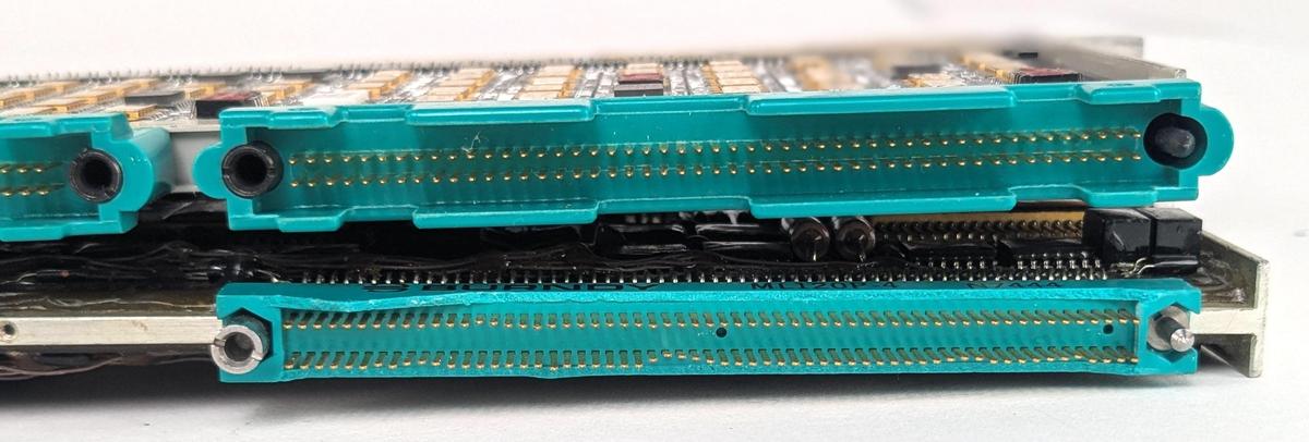 The connectors on a standard IBM 4 Pi page (top) and the IOP page (bottom). The 4 Pi page is courtesy of Eric Schlaepfer. The slight waviness is just due to bent pins.