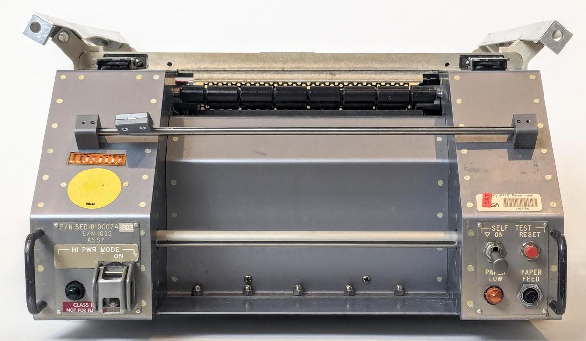 Front view of the Shuttle teleprinter. The bar across the middle holds a paper cutter for removing the output.