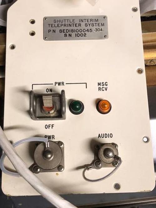 The panel on the outside of the locker, used for connection to the teleprinter. From distantsuns, NASA Space Flight forum.