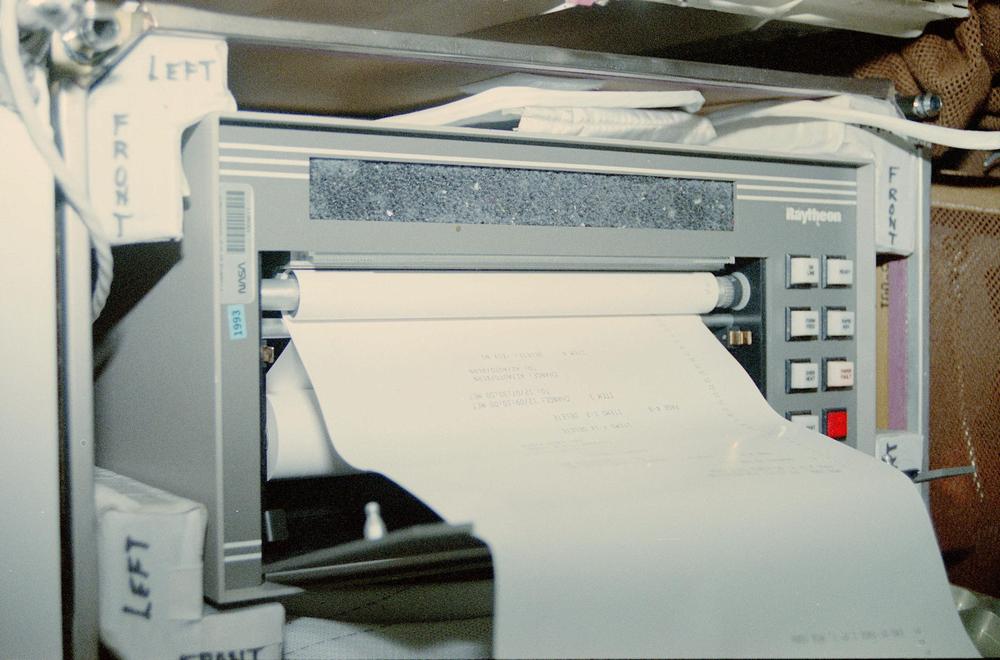 The Thermal Impulse Printer System (TIPS) on flight STS-58. From National Archives. The description says that this device is the teleprinter but it is TIPS.