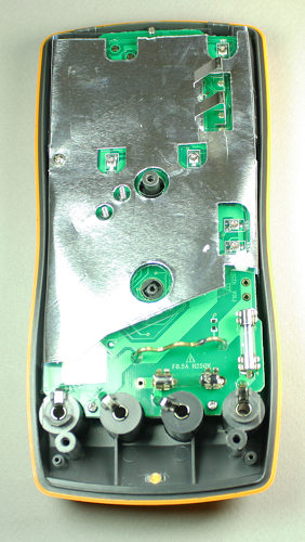 Inside the Tenma 72-7740 DMM, showing the foil shield, the two fuses, and the thick wire for high-current measurements.